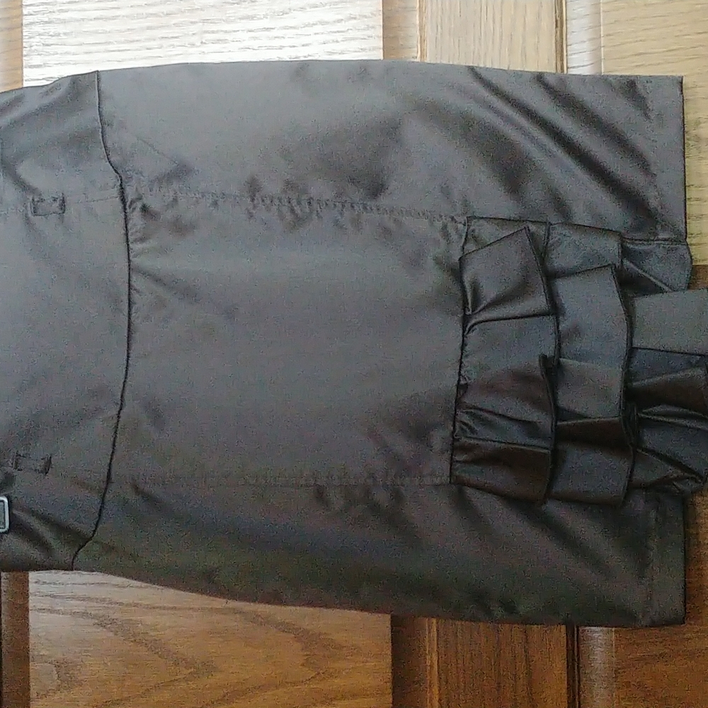 Black satin skirt,with a rear, ruffled kick pleat